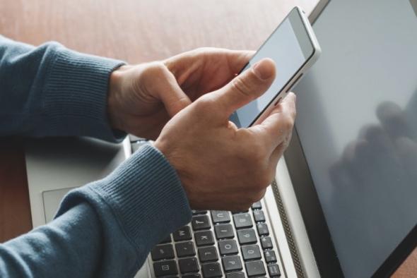 An iPhone and a computer