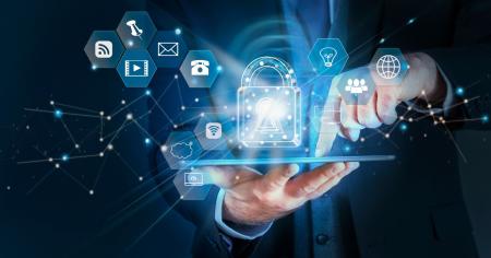 A man holding a tablet with a network icons floating above it.